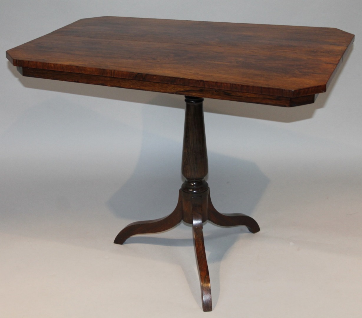 Appraisal: A thC rosewood snap top occasional table the canted top