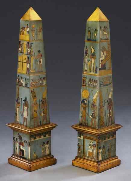 Appraisal: Pr Egyptian gilt and polychrome wood obelisksdepicting an ancient Egyptian