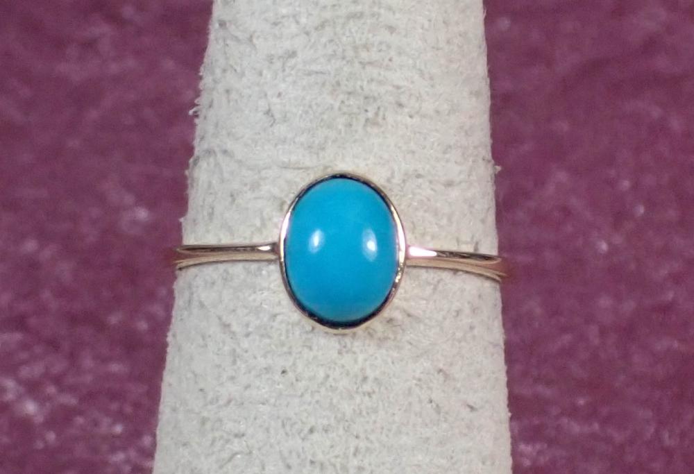 Appraisal: TURQUOISE AND FOURTEEN KARAT GOLD RING The yellow gold ring