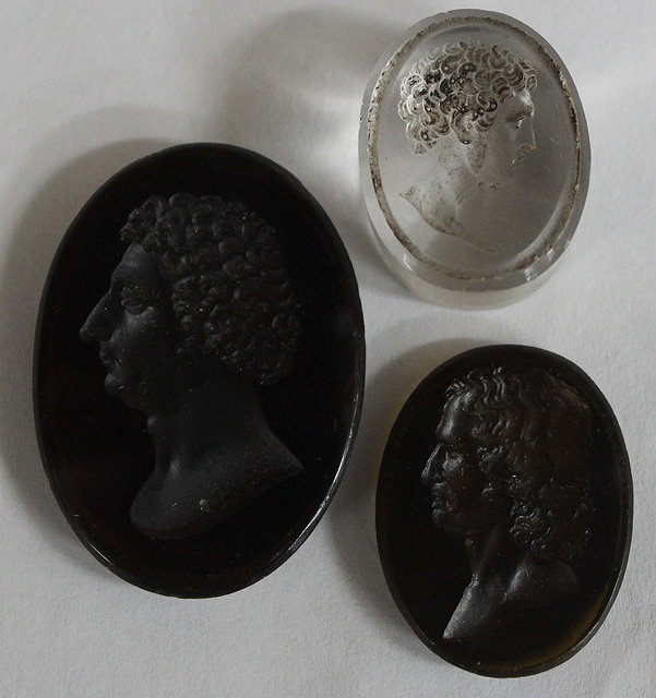 Appraisal: AN AMBER COLOURED INTAGLIO depicting a gentleman indistinctly inscribed to