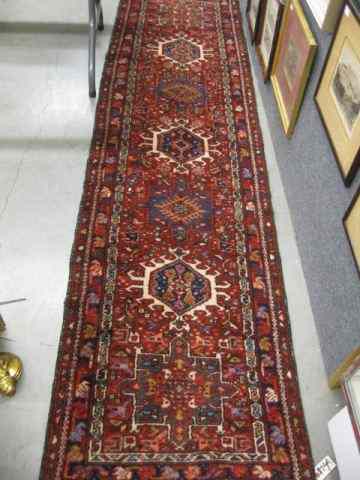 Appraisal: Heriz Persian Handmade Runner geometric medallions elaborate floral trim '