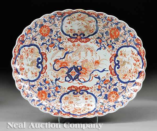 Appraisal: A Large Japanese Imari Chrysanthemum-Form Porcelain Dish decorated in blue