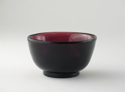 Appraisal: A Chinese Beijing amethyst glass bowl raised on a small