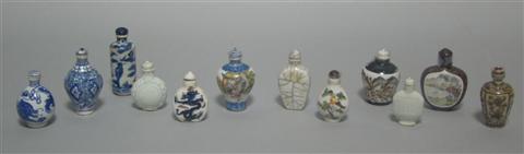 Appraisal: TWELVE PORCELAIN SNUFF BOTTLES Including one underglaze iron-red bottle with