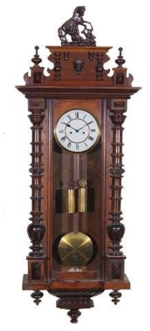 Appraisal: A WALNUT VIENNA REGULATOR TYPE WALL CLOCK the pediment with