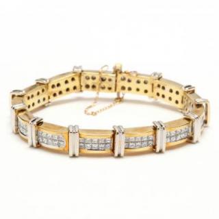 Appraisal: KT Two Color Gold and Diamond Bracelet bracelet with curved