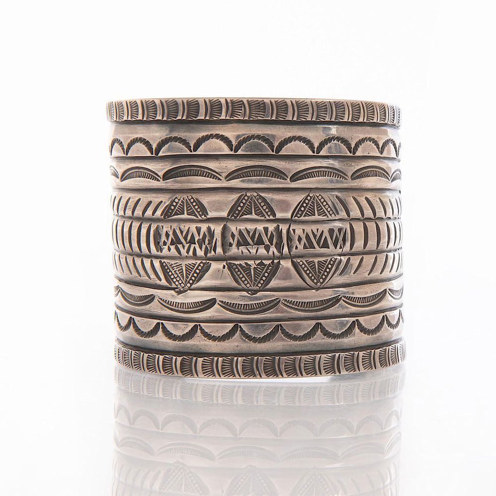 Appraisal: WIDE STAMPED NAVAJO SILVER BRACELET Cuff bracelet with stamped design