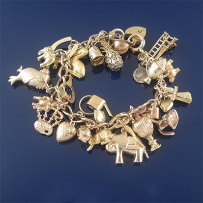 Appraisal: A gold charm bracelet the ct gold plain curb link