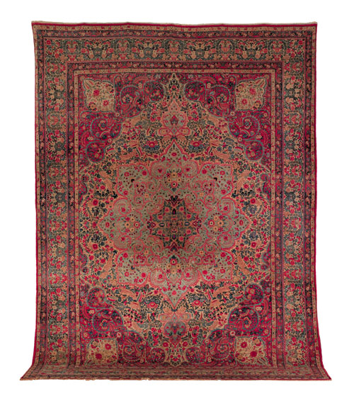 Appraisal: Kirman carpet ca with a floral decorated medallion ' x