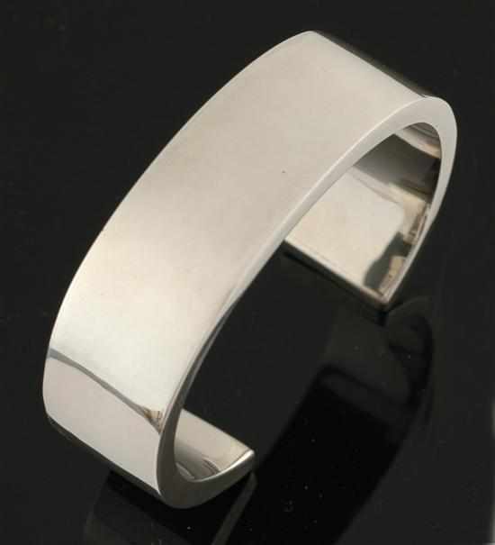 Appraisal: A silver cuff bangle The wide cuff with squared edges