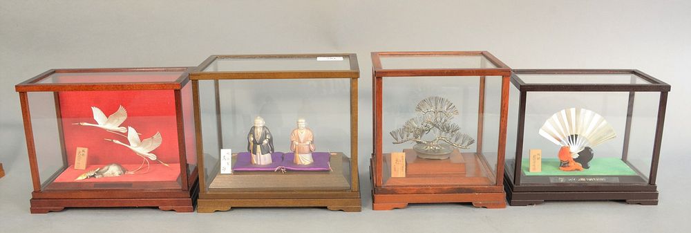 Appraisal: Four Japanese silver figures in shadow boxes to include Japanese