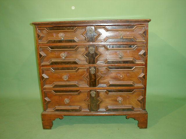 Appraisal: A mahogany chest in the Jacobean style having a cross