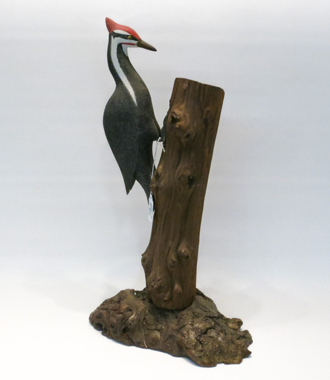 Appraisal: CARVED AND PAINTED WOOD SCULPTURE depicting a pileated woodpecker on