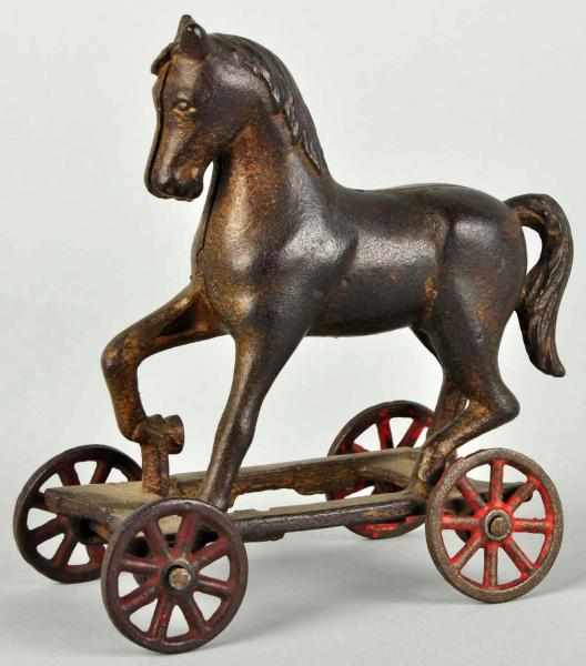 Appraisal: Cast Iron Horse on Wheels Still Bank Manufactured by AC