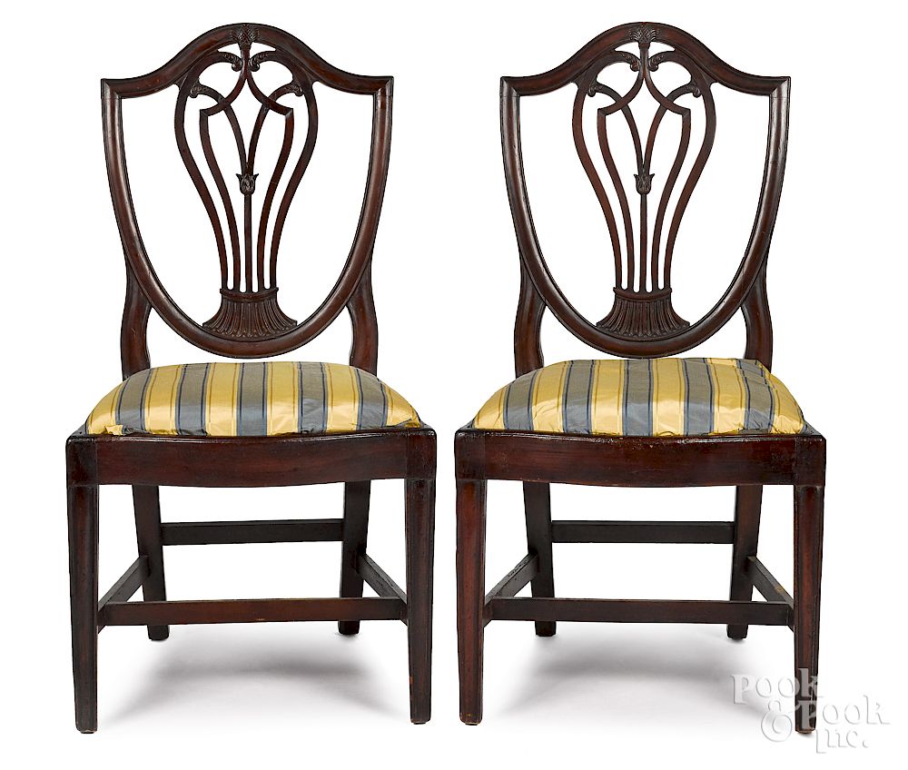 Appraisal: Pair of Federal carved mahogany shieldback dining chairs Exclusive on