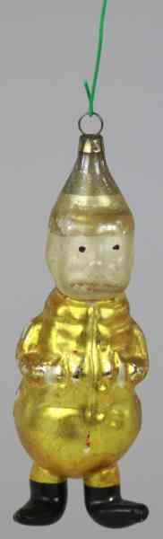 Appraisal: YELLOW KID WITH EXTENDED LEGS ORNAMENT Germany blown glass Christmas