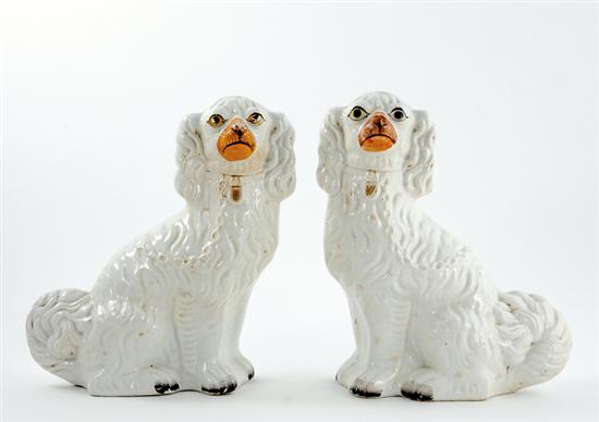 Appraisal: Pair Staffordshire spaniels th century seated figures with painted faces