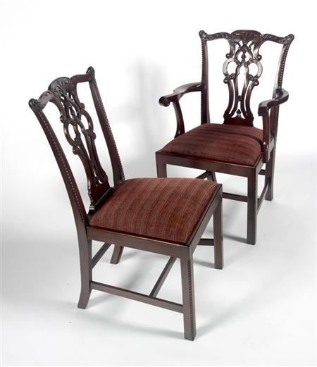 Appraisal: A set of twelve mahogany Chippendale style dining chairs the