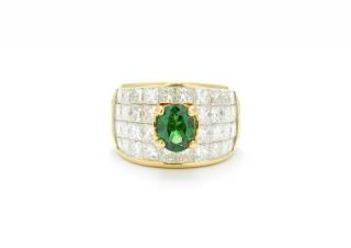 Appraisal: A TSAVORITE AND DIAMOND BAND A TSAVORITE AND DIAMOND BAND