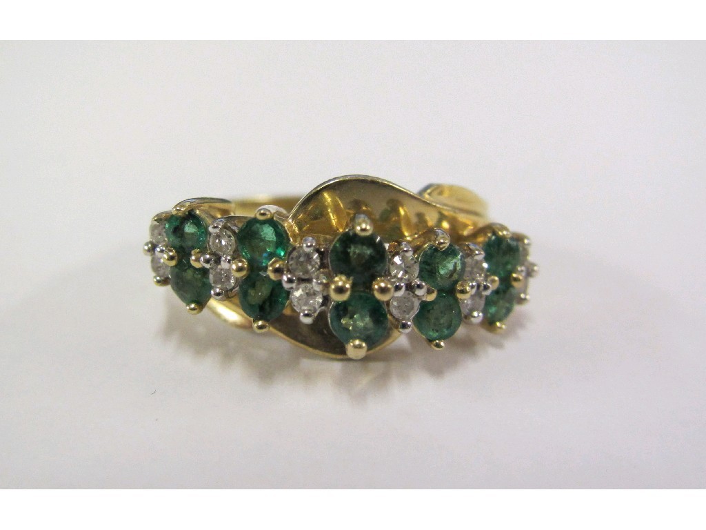 Appraisal: Gold emerald and diamond set dress ring with two horizontal