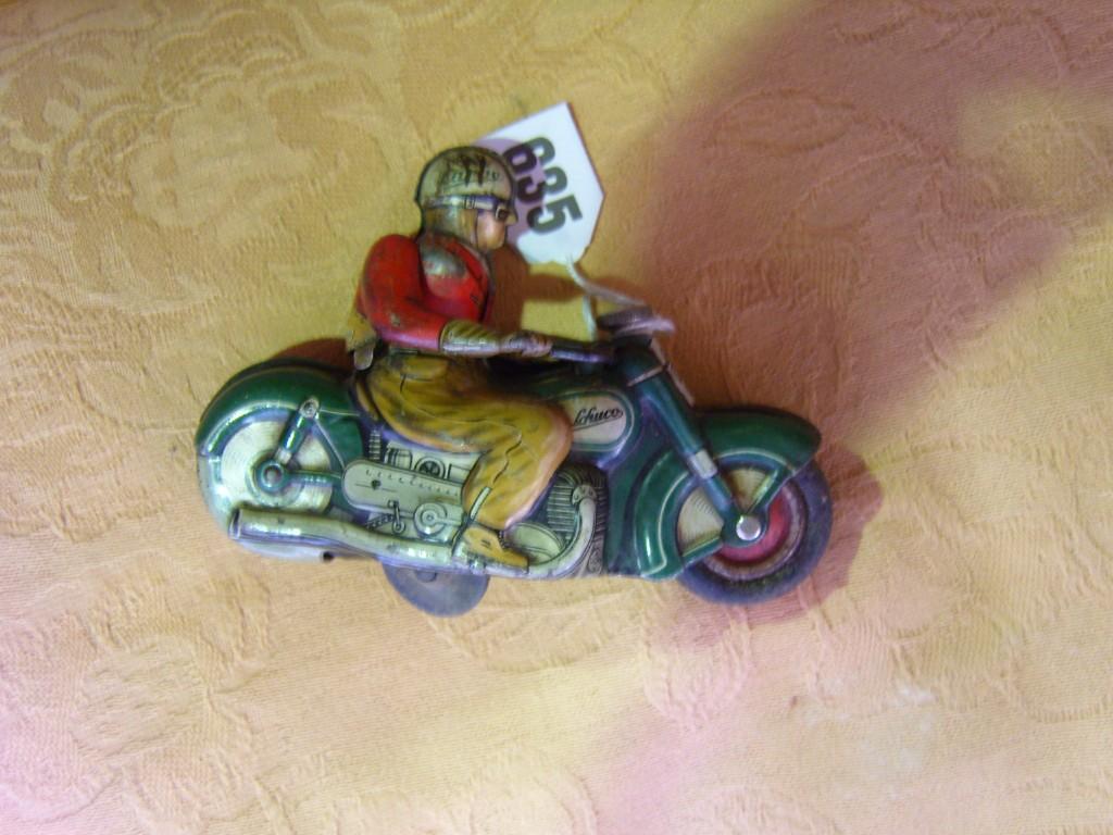 Appraisal: A Schuco Curvo tin plate model of a motorbike and