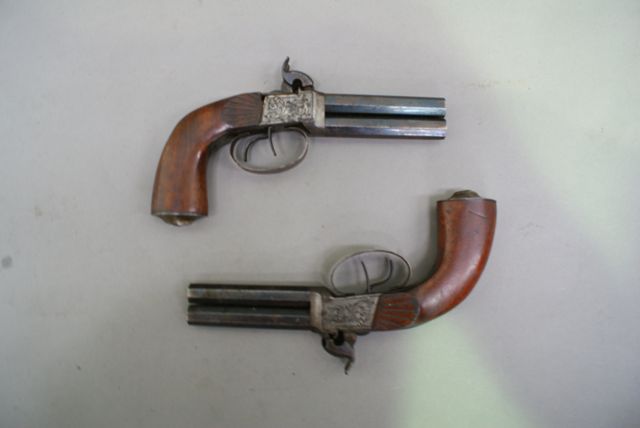 Appraisal: A pair of European over and under double barrel pistols