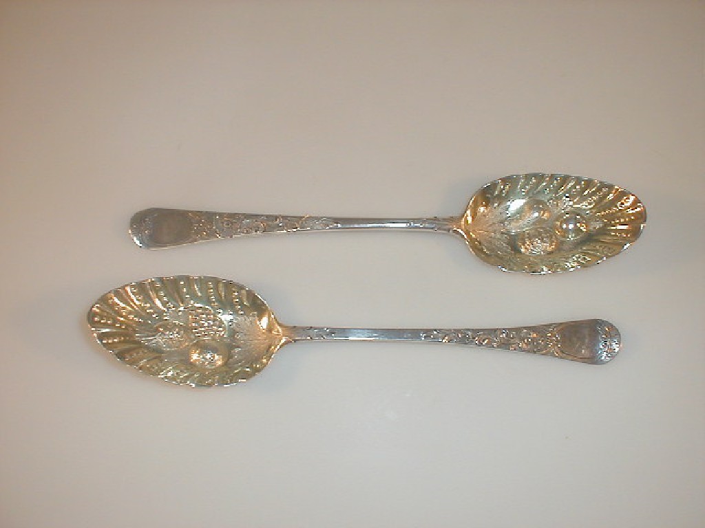 Appraisal: A matched pair of George III silver berry spoons with