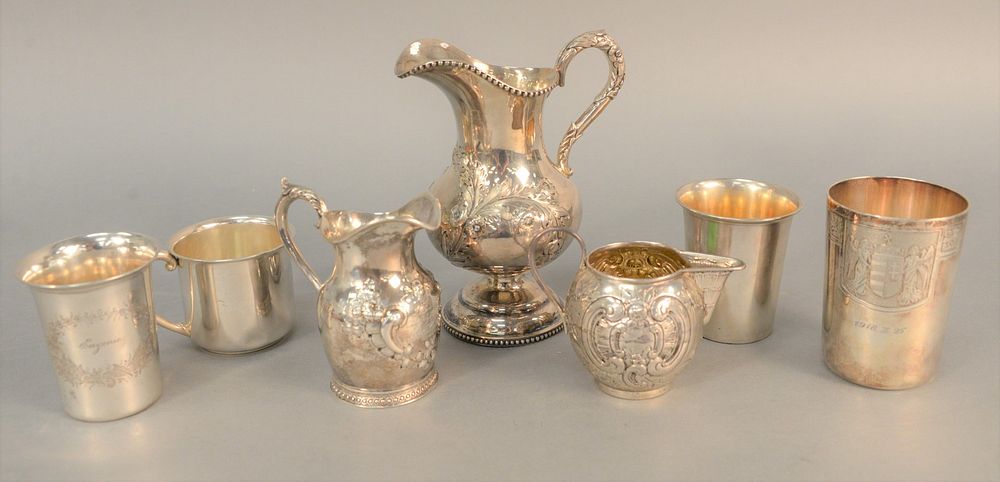 Appraisal: Silver lot to include three-piece repousse tea set along with