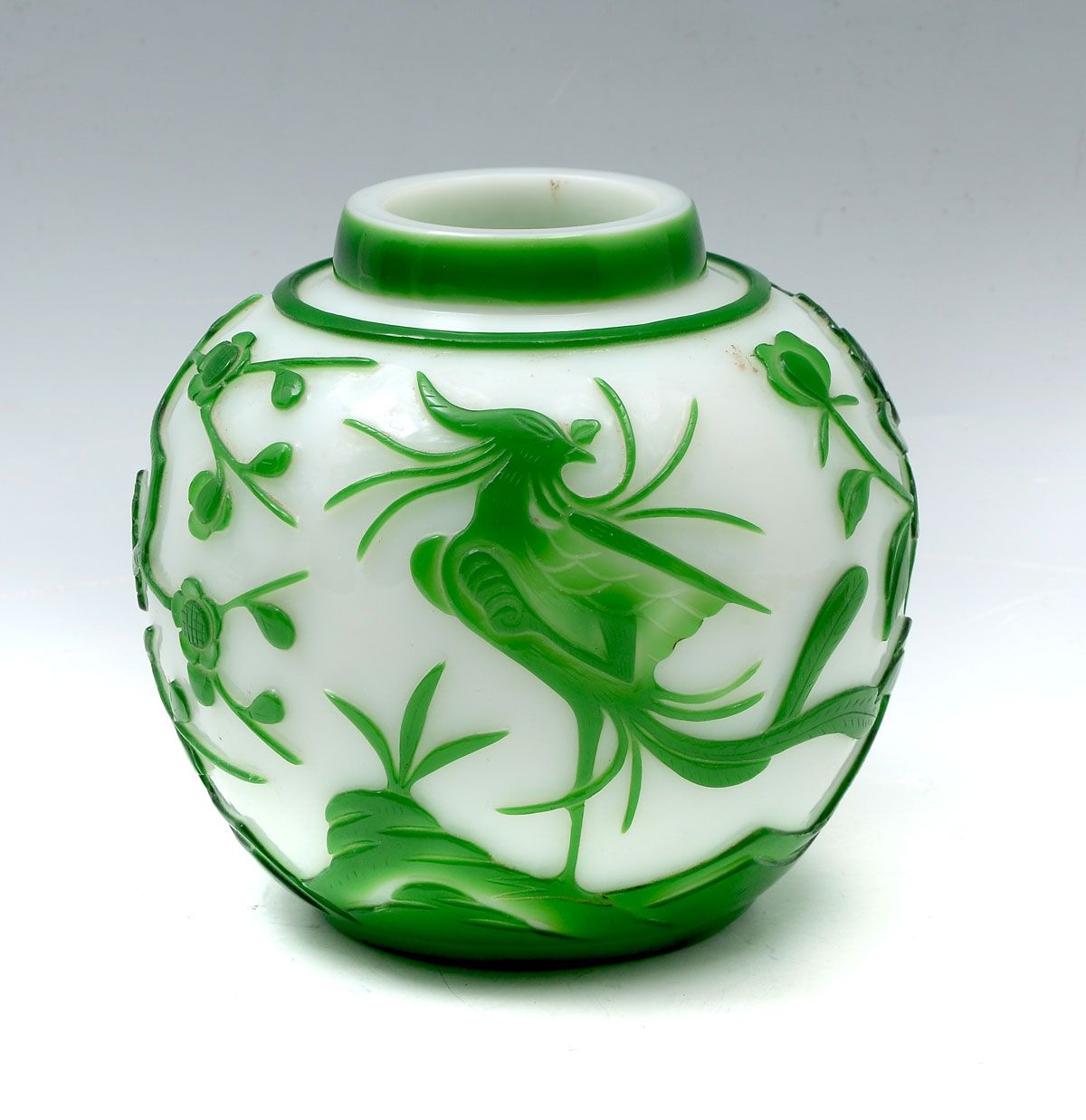 Appraisal: CHINESE GREEN WHITE PEKING GLASS VASE Circa Chinese carved Peking