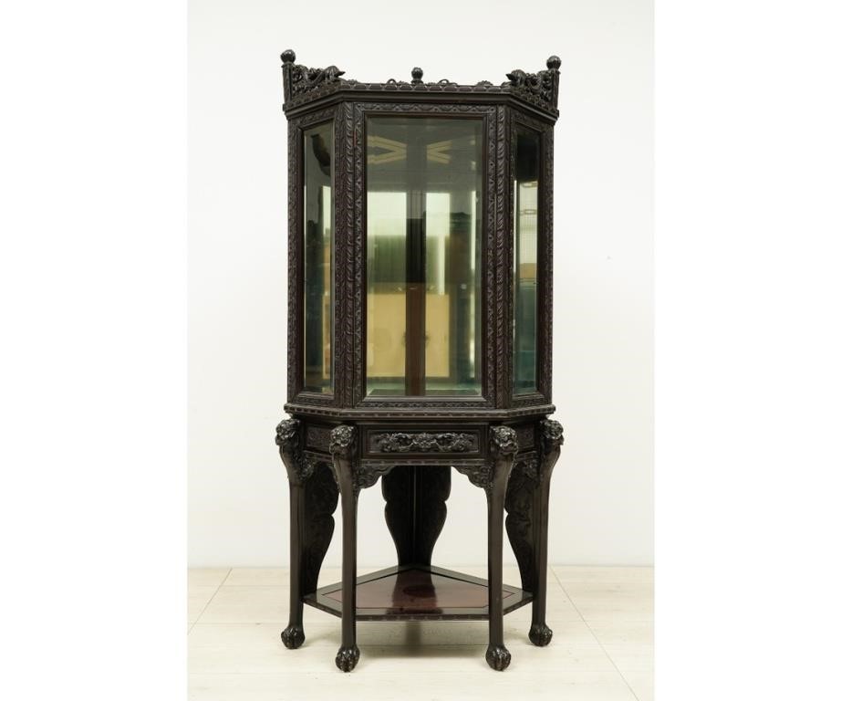 Appraisal: Asian black carved two-piece cabinet with beveled glass h x