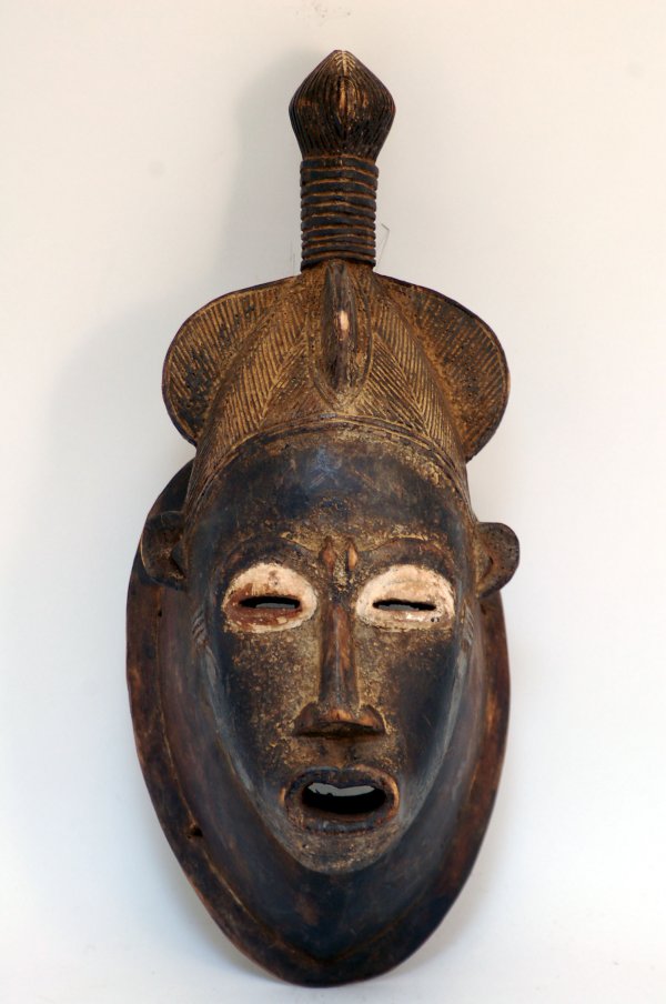 Appraisal: Baule carved wood mask with typical pointed chin T-shaped nose