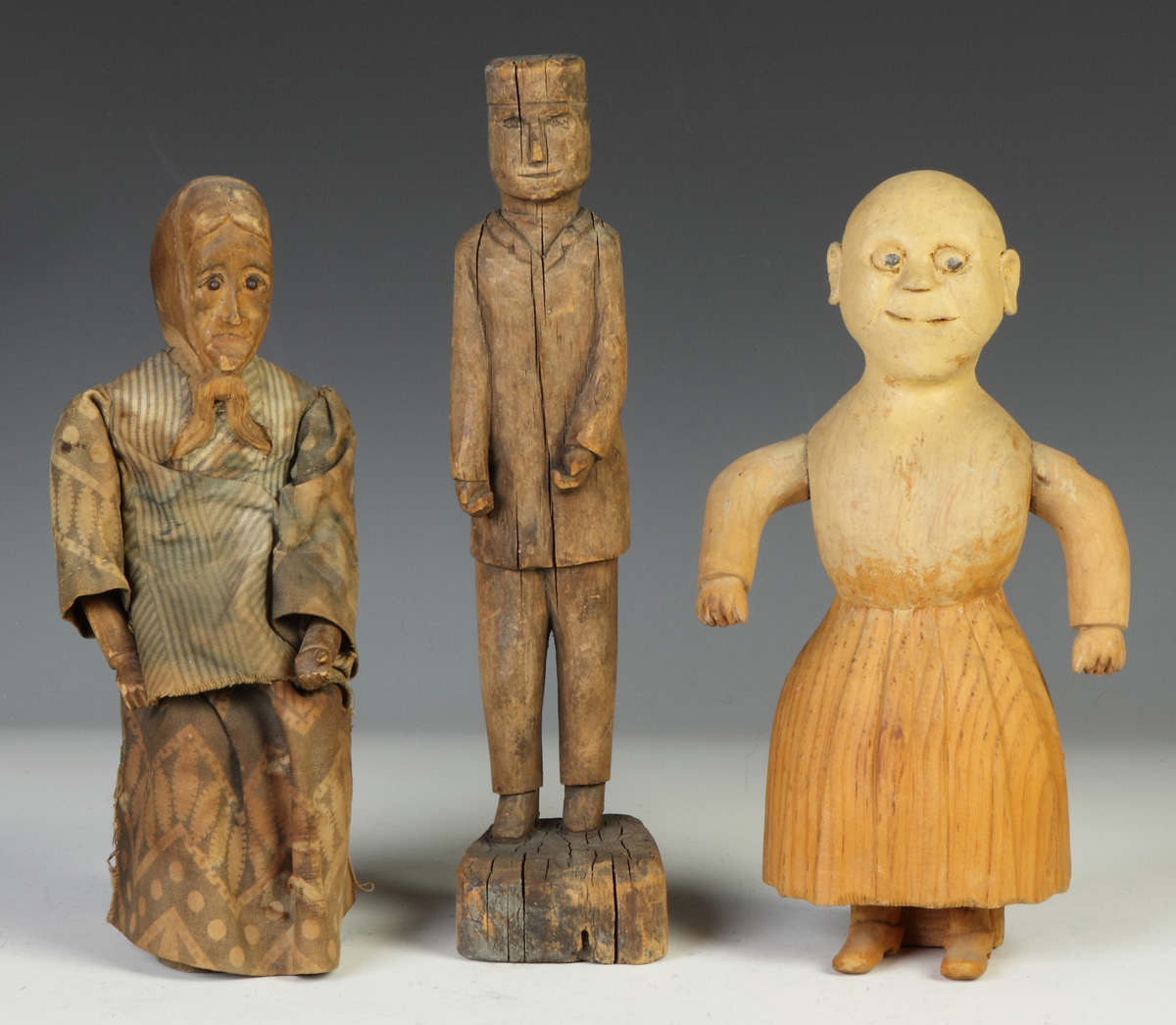 Appraisal: Three Carved Primitive Figures Early th cent L to R