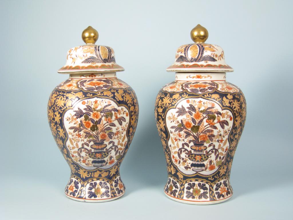 Appraisal: A pair of Chinese lidded baluster Vases decorated flowers on