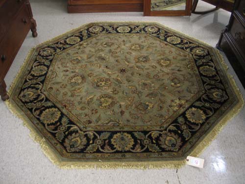 Appraisal: AN OCTAGONAL ORIENTAL CARPET Persian Isfahan design of scrolling floral