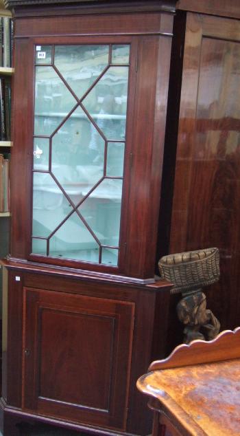 Appraisal: A Victorian mahogany and line inlaid floor standing corner cabinet