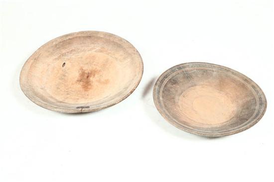 Appraisal: TWO TREENWARE CHARGERS American early th century hardwood Turned chargers