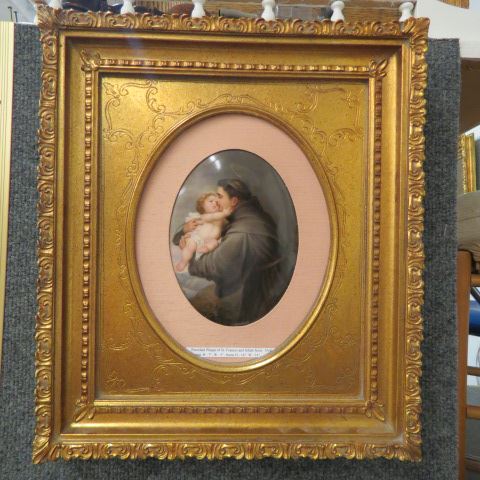 Appraisal: Painting on Porcelain Plaque St Franciswith Infant Jesus oval image