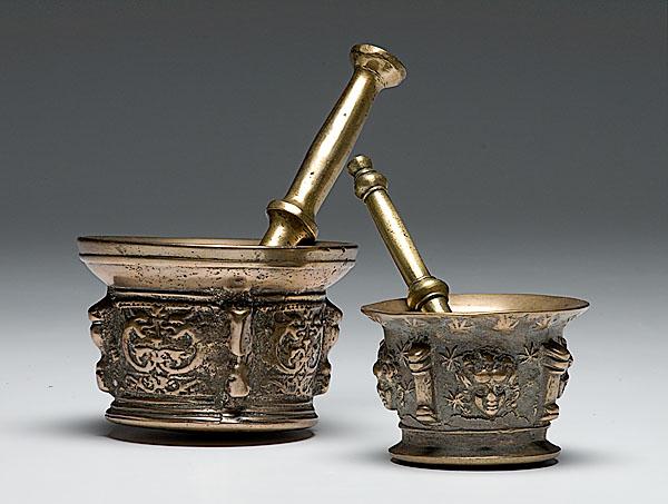 Appraisal: TWO BRASS CLASSICAL MOTIF MORTARS AND PESTLES including one brass