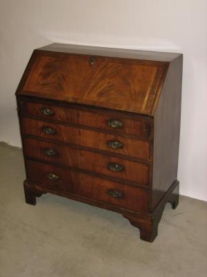 Appraisal: A MAHOGANY BUREAU the banded fall front enclosing interior with