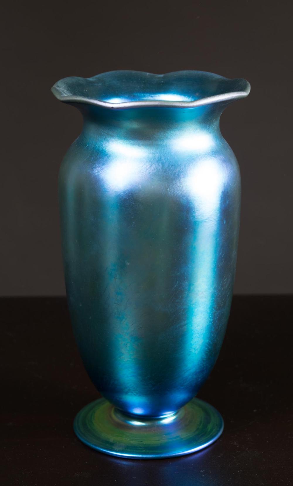 Appraisal: STEUBEN AURENE ART GLASS FOOTED VASE iridescent blue with high