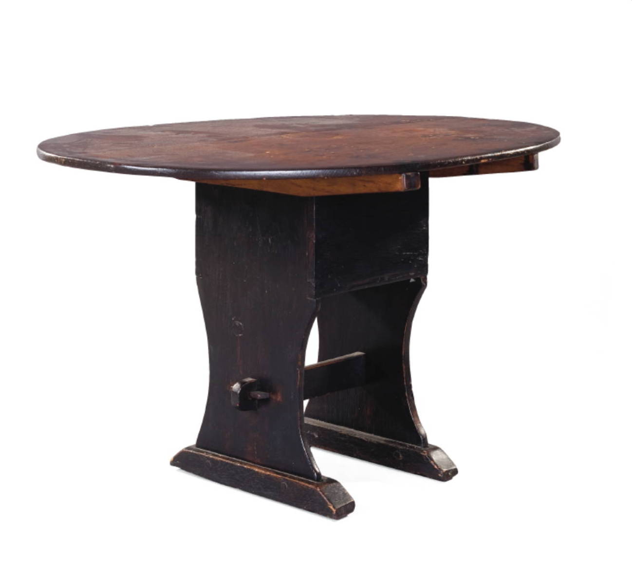 Appraisal: PINE HUTCH TABLE IN DARK SURFACE The oval top tilting