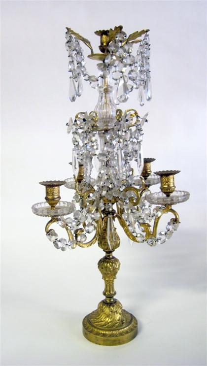 Appraisal: Continental gilt metal and luster candelabrumThe central fluted baluster form