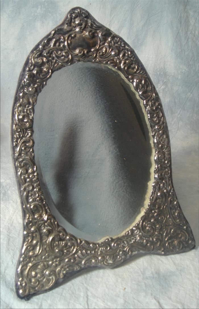 Appraisal: English sterling silver repousse mirror beveled glass London th c