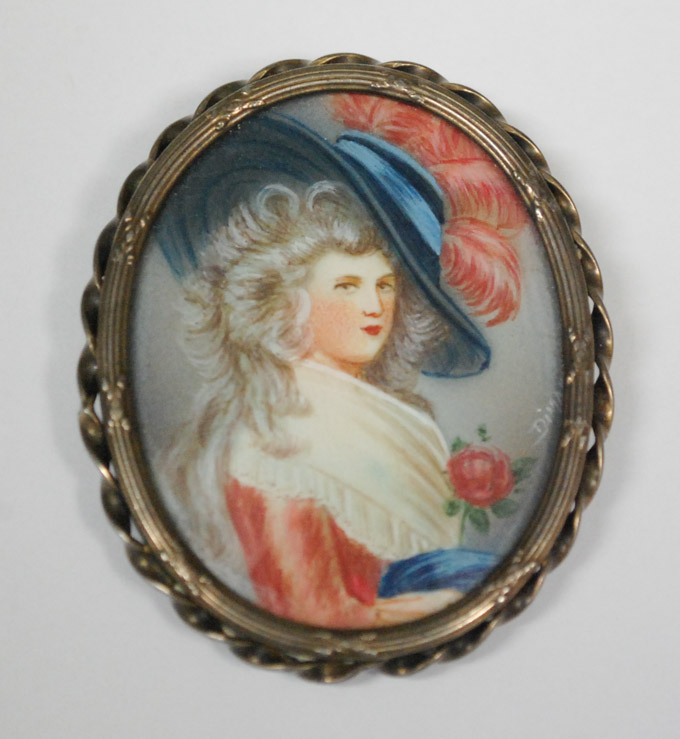 Appraisal: HAND PAINTED PORTRAIT BROOCH featuring a young woman of means