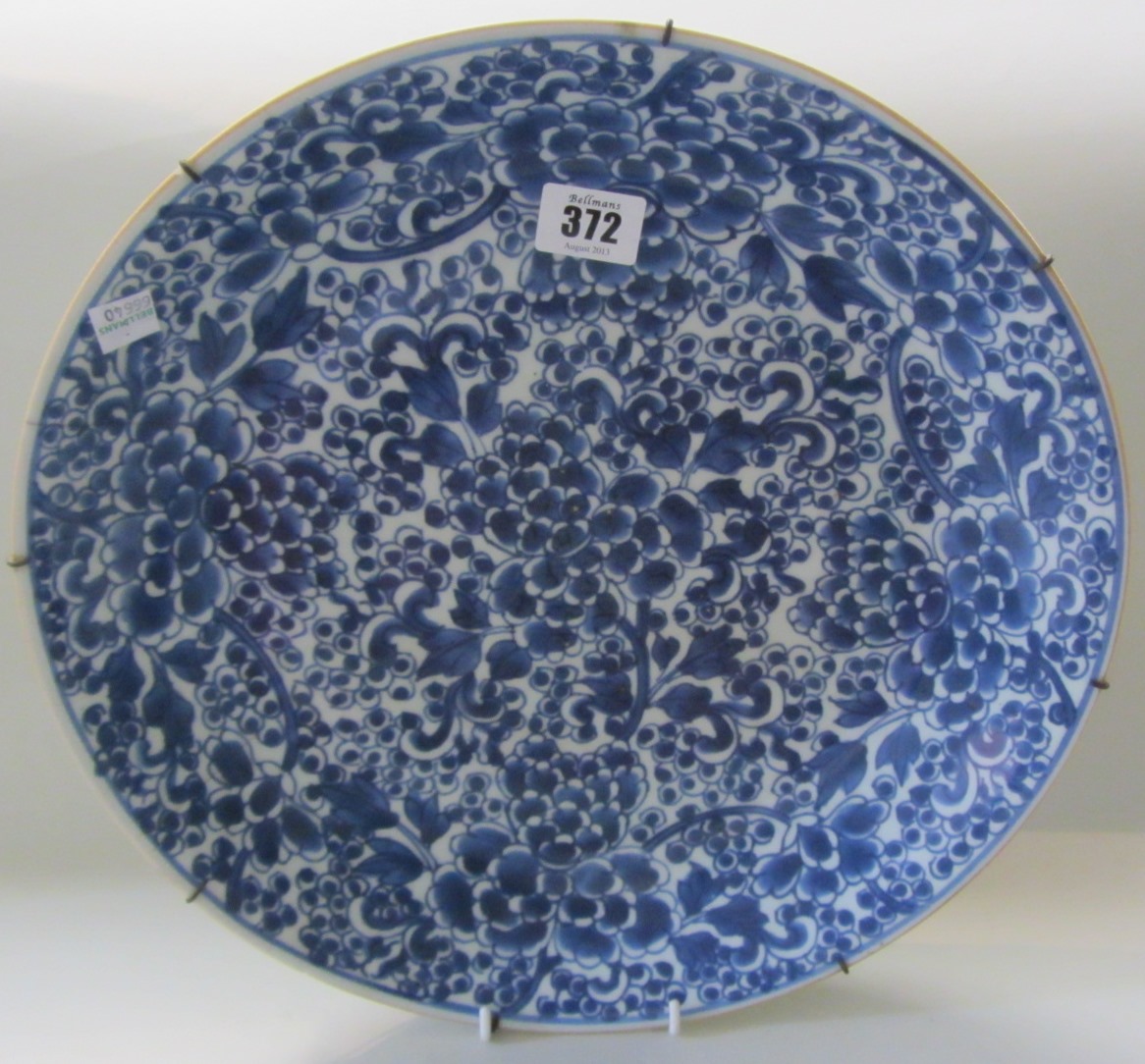 Appraisal: A Chinese blue and white dish Kangxi painted with flowering