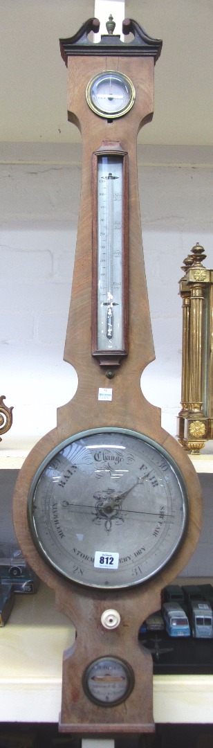 Appraisal: A George III mahogany cased wheel barometer with thermometer by