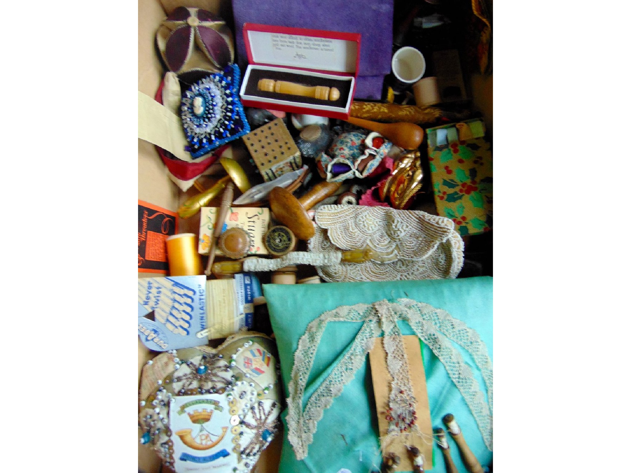 Appraisal: A box containing a collection of vintage sewing and embroidered