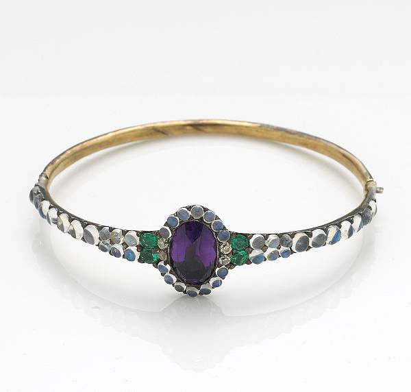 Appraisal: An amethyst moonstone emerald and silver-topped k gold bangle bracelet