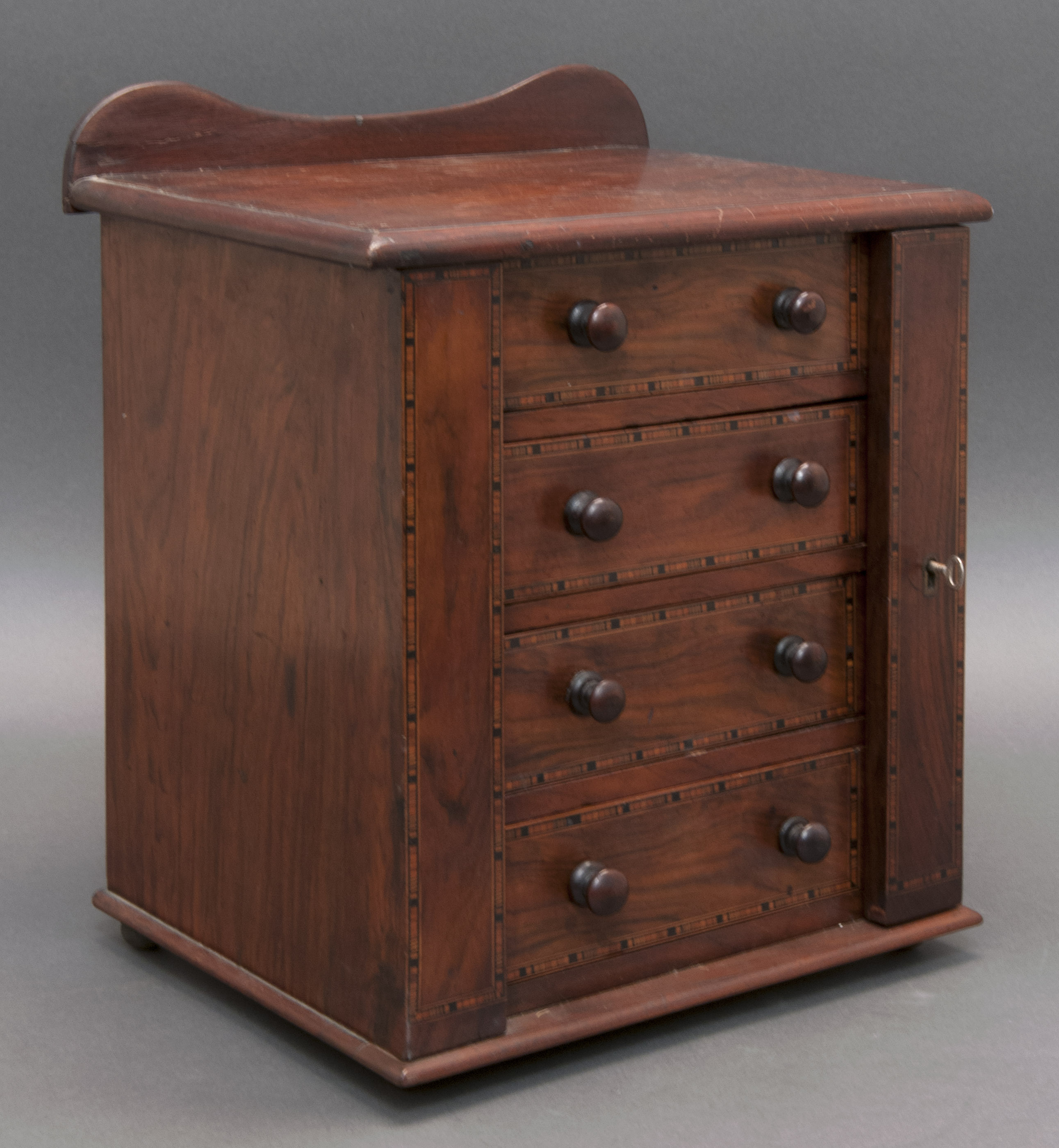 Appraisal: MINIATURE VICTORIAN WELLINGTON CHEST OF DRAWERS Late th Early th