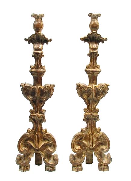 Appraisal: A pair of Baroque style carved candlesticks height in